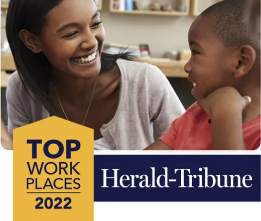 Herald-Tribune Top Places to Work 2022 - happy woman helping child in preschool